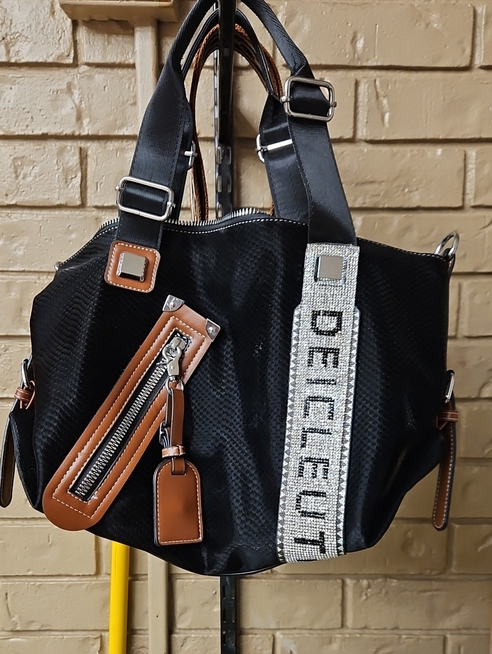 Black Hobo Bag with Brown Trim and Woven Logo Strap